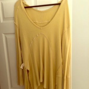 Yellow oversized free people sweater.